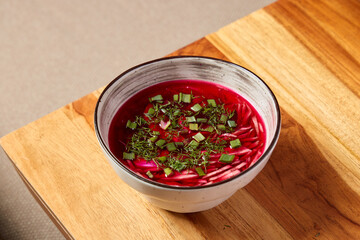 Enjoy a Delightfully Vibrant Beetroot Soup Made with Fresh Herbs Served in a Stylish Bowl
