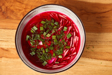 Enjoy a Vibrant Cold Beet Soup Full of Fresh Herbs and Colorful Garnish for Flavor