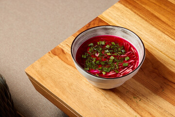 Deliciously Vibrant Beetroot Soup Garnished with Fresh Herbs for a Colorful Presentation