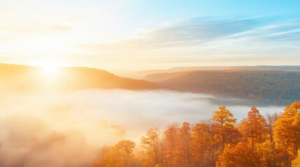 Fototapeta premium Golden sunrise illuminates autumn landscape with misty valley views