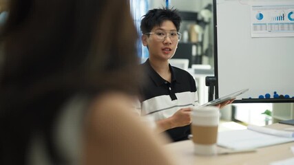 In a modern office interior, Asian business friends brainstorm a strategic growth plan. Through a hackathon and analysis, they aim to predict and summarize future business success.	 - Powered by Adobe