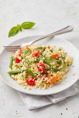Millet with cherry tomatoes and beans