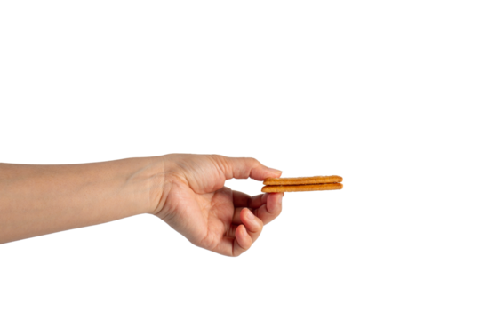 Square cracker in hand on transparent background