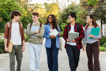 Group of university student friends walking going to classes. Diversity in school and education