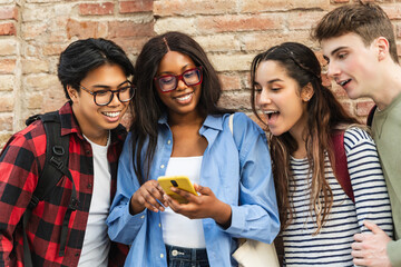 Group of university student friend using mobile phone app together to share content on social media