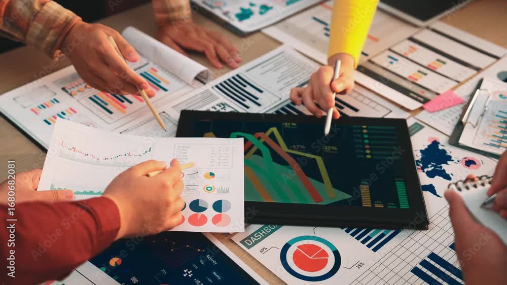 Poster a dynamic workplace scene showcasing hands engaged in data analysis with charts and graphs, emphasiz