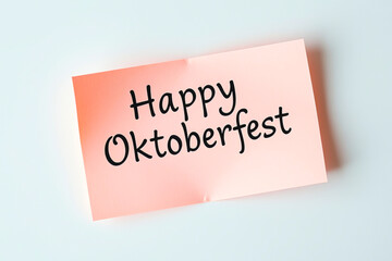 Text Happy Oktoberfest on pink note