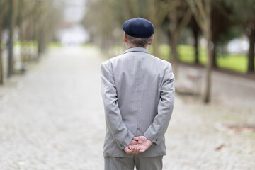 Elderly man enjoying a relaxing walk in the park