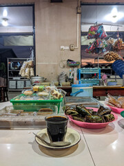 Assorted traditional cakes neatly arranged in colorful plates, wrapped and unwrapped, ready to be...