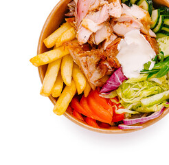 Delicious mix of grilled chicken, fresh veggies, and fries served in a bowl