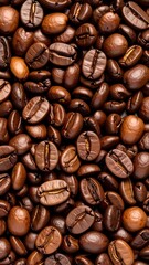 Fototapeta premium Close-up view of roasted coffee beans, displaying rich browns and textures.