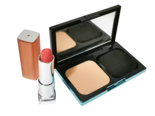 A modern still life shot featuring an open facial powder compact and a tube of lipstick. Focus on the clean lines, minimalist composition, and the products' textures against a white backdrop.