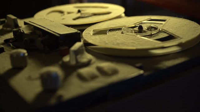 Old dusty vintage professional analog multitrack studio tape player reel 