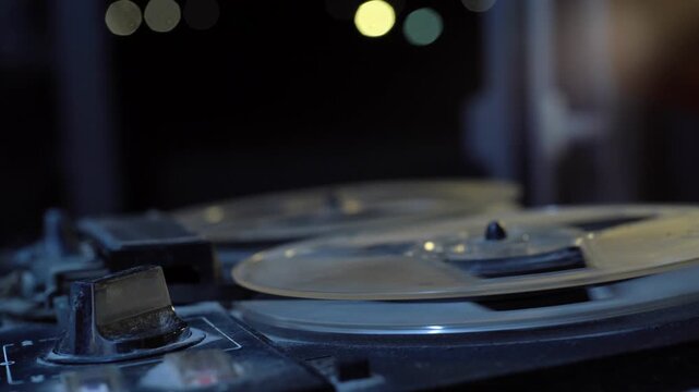 reel tape recorder. Vintage retro aged historical reel audio recorder and tape rolls.