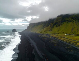 Dramatic black sand beach, rugged cliffs