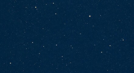 Fototapeta premium A dark blue night sky filled with countless white and yellow stars