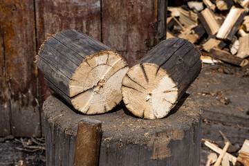 Split Firewood Logs on Wooden Stump in Rural Setting