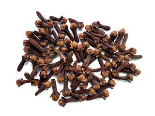 A pile of fresh dried brown cloves isolated on white background. Spice cloves. Close up of dried aromatic clove flower buds. Top view.