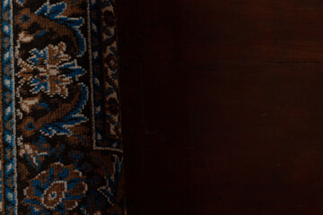 blue carpet on wooden floor, wooden interior, prayer rug