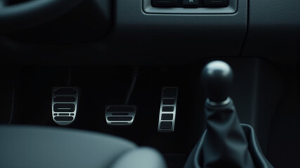 Obraz premium Manual car pedals and gear stick inside modern vehicle interior daytime view