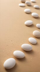 Smooth white pebbles scattered on a beige sandy beach