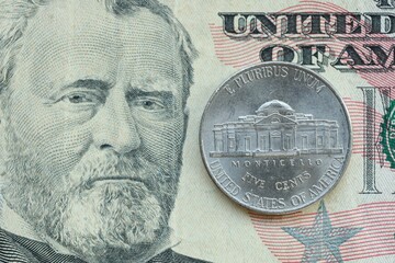 American cent coin on dollar bill close up. United States currency