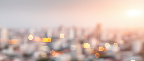 Blurry cityscape background with warm sunlight and glowing bokeh lights creates soft urban atmosphere perfect for modern design or presentation use
