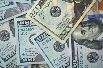 Big amount of different dollar bills close up. Hundred fifty twenty ten and five dollar banknotes
