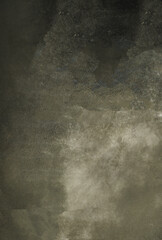 Dusting effect creating abstract shapes on dark background