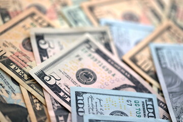Big amount of different dollar bills close up. Hundred fifty twenty ten and five dollar banknotes
