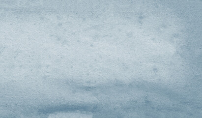 The blue paper creates a textured, elegant background with spots with irregularities on the surface.