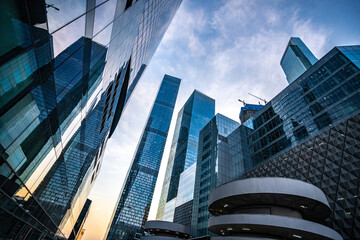 Cityscape with High-rise Glass Buildings and Urban Reflections at Dusk