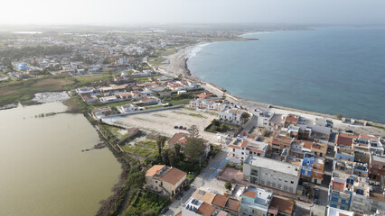 Waves crashing against the ancient stones of Sicily – a coastal town where history and the...
