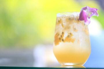 passion fruit lemonade background, cold lemonade in a glass, delicate texture cold tropical drink...