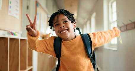 Education, peace sign and smile of black child in school corridor for development, learning or study. Emoji, future and growth with happy African boy in academy hallway for knowledge as student