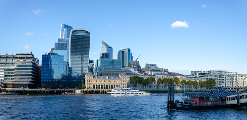 Obraz premium London, England, United Kingdom - October 2024: Panoramic view of Bank, London's leading financial district with blue sky and clouds autumn or fall
