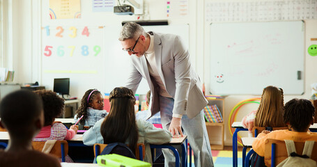 Education, children and teacher in classroom with help, project advice and individual assessment....