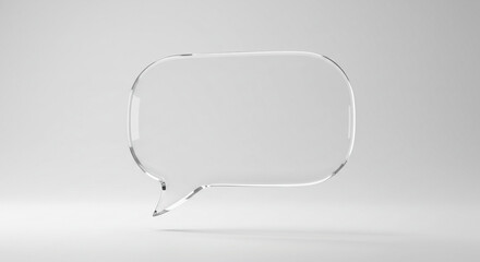 A clear glass speech bubble floating in a white space with soft lighting and subtle shadow effects around it