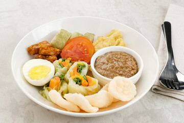 Gado Gado, Indonesian traditional vegetable salad with peanut sauce, rice cake, tofu, tempeh and egg