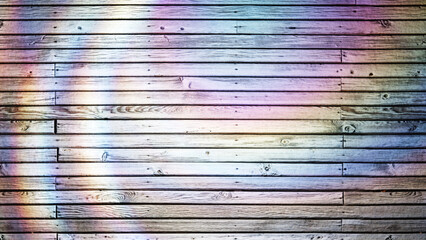 Colorful iridescent light diffraction creating a moving circular pattern on wooden planks