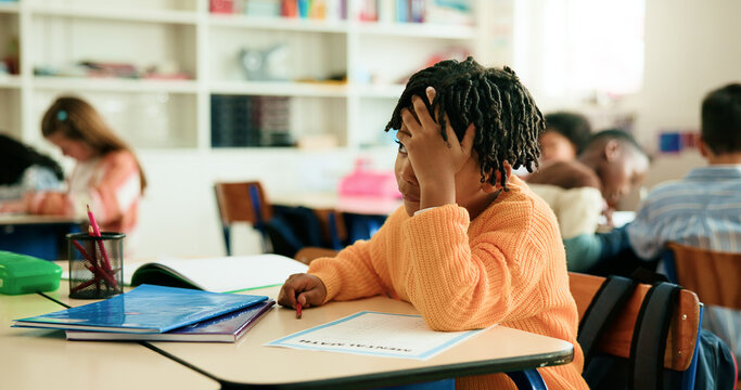 Stress, fail and boy in classroom for learning education, daycare or nursery with students. Kindergarten, worry and frustrated kid at school for child development, assessment or knowledge evaluation