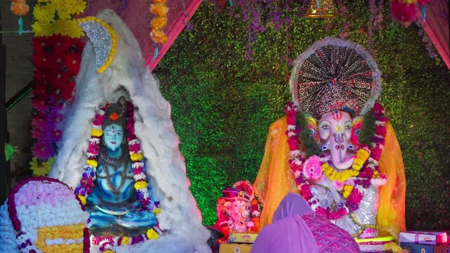 indian Woman Preparing for Aarti of Shiv Ji and Ganesh Ji on Ganesh Chaturthi