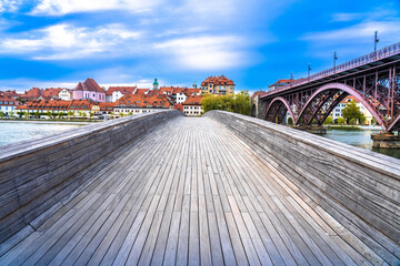 Wooden bridge and Drava river bank in historic town of Maribor, Slovenia