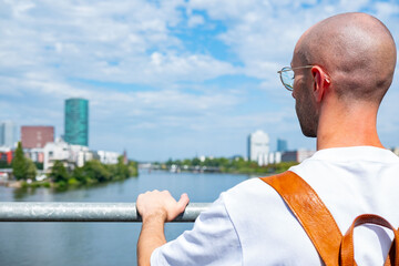 male traveler enjoying city view, Main river, Journey and destination, new adventure in...