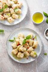 Homemade potato gnocchi with basil and chilli