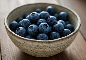 Fresh Blueberries in a Rustic Bowl on a Wooden Table Surface for Culinary and Healthy Eating