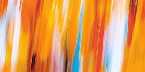 Colorful abstract background with vibrant orange yellow and blue tones blended in streaked motion effect. Modern artistic texture for creative design.