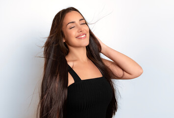 Naklejka premium Beautiful young woman with long dark hair and happy smile