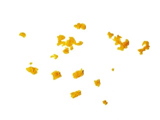 crispy fried flour crumbs flying on an isolated white background, for design, fried chicken. Fried popcorn chicken falling in the air isolated on white background.