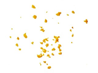 crispy fried flour crumbs flying on an isolated white background, for design, fried chicken. Fried popcorn chicken falling in the air isolated on white background.